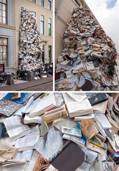 Book sculpture of thousands of books pouring out Museum Meermanno window, Alicia Martin