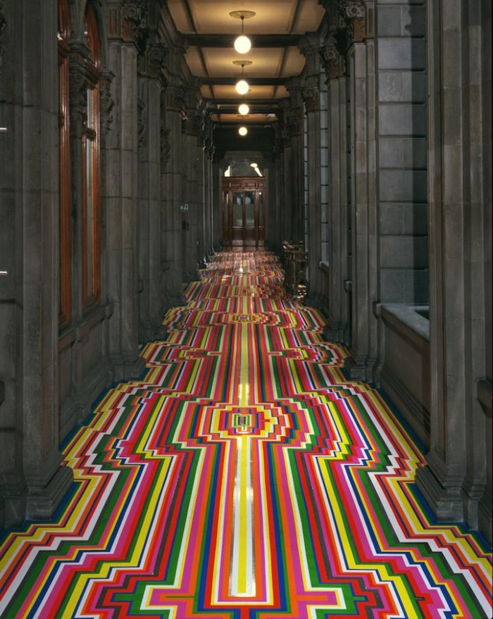 Jim Lambie, artist that uses colored tape on different surfaces to create patterns, floors, walls, stairs, art
