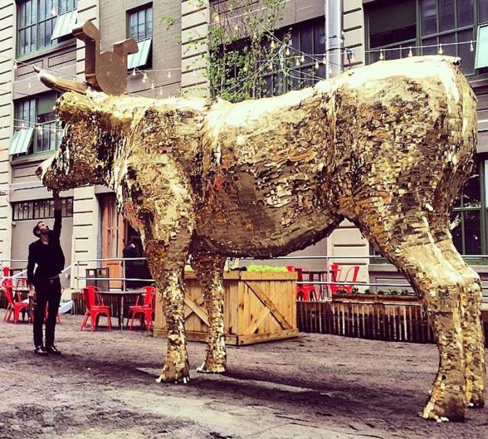Cash Cow pinata by sebastian errazuriz, golden calf filled with 1000 dollars for NYCxDesign Festival, Industry City, 2014 Wanted Design
